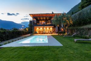 a house with a swimming pool in the yard at Innerbachlerhof - Mut in Postal