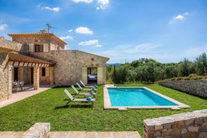 an external view of a villa with a swimming pool at Can Bosco in Son Servera