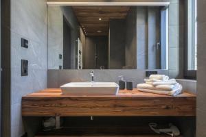 a bathroom with a sink and a mirror at Innerbachlerhof - Mut in Postal +27 photos