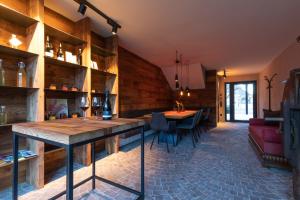 a kitchen and dining room with wooden walls and a table at Innerbachlerhof - Mut in Postal