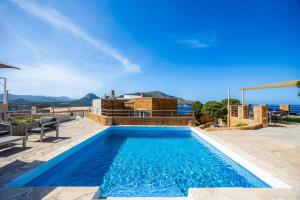 a swimming pool in a villa with a view at Can Eolo in Capdepera