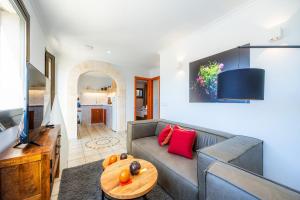 a living room with a couch and a table at Can Eolo in Capdepera