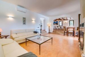 a living room with a couch and a table at Finca Kiana in Sencelles