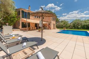 an external view of a villa with a swimming pool at Finca Kiana in Sencelles