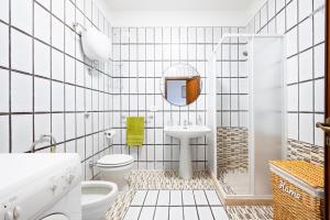 a bathroom with a sink toilet and a mirror at Stella Vacanze in Otranto