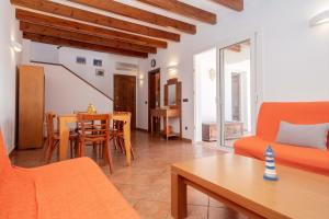 a living room with a couch and a table at Villa Payu in Ciutadella