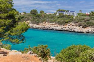a view of the blue river from a hill at Villa Payu in Ciutadella