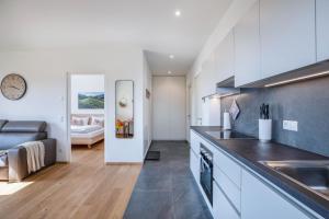 a kitchen with a sink and a counter top at Meine Bleibe Apartment Terra in Appiano sulla Strada del Vino