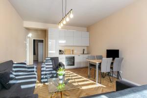 a living room with a couch and chairs and a table at Hotel zur Panke Wohnung 1 in Kolonie Röntgental +12 photos