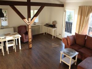 a living room with a couch and a table at Ferienhaus Sara in Seebach