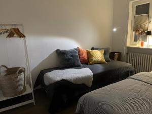 a bedroom with a bed with pillows on it at Ferienhaus Sara in Seebach