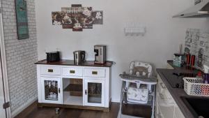 a kitchen with a white cabinet and a sink at Haus Münsterland in Nordwalde