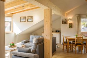 a living room with a couch and a table at Ferienwohnung Bergpanorama in Garmisch-Partenkirchen