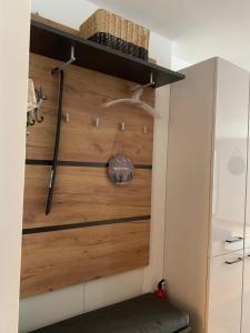 a closet with a wooden door in a room at Apartment Bergzeit Sterzing in Vipiteno