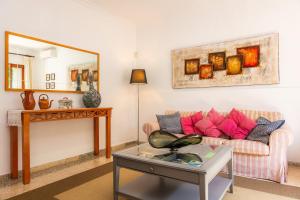 a living room with a couch and a table at Can Tiro in Islas Baleares +34 photos