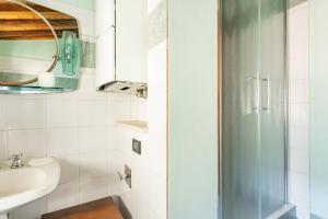 a bathroom with a shower and a sink at La Casina di Elisa in Montecarlo +19 photos
