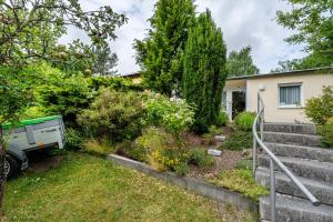 a garden in front of a house at Bungalow 179 in Zeulenroda