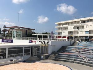 a building with stairs in front of a building at Torre dell'orso centralissima vista mare in Torre dell'Orso