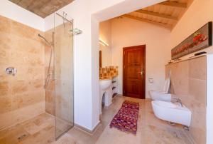 a bathroom with a shower and a sink and a toilet at Villa Miramar in Puntagorda +35 photos