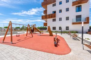 a playground in front of a building at Adhara - 034 in Torre del Mar
