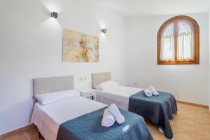 a room with two beds and a window at Almela's in Santa Pola +23 photos