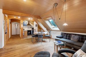 a living room and kitchen in a tiny house at Ferienwohnung Schweizer in Bernau im Schwarzwald