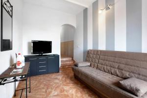 a living room with a couch and a flat screen tv at Casa Marrero in La Guancha
