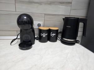 a black blender and two trash cans on a counter at Studio Veronica - Ultracentral, langa Tomis Mall, Self Check-in, Free Parking, Fast WiFi, 10 min Plaja Modern in Constanţa