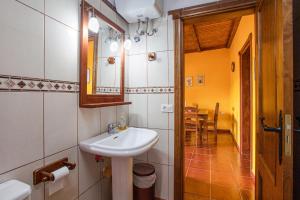 a bathroom with a sink and a mirror at Casa Chinamada in Las Lagunas +14 photos