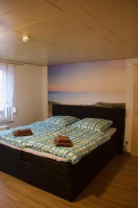 a bedroom with a bed with a view of the ocean at Ferienhaus Kiara in Westerhausen
