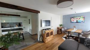 a living room with a couch and a table at Ferienwohnung Schwarzwald-Traum in Haslach im Kinzigtal