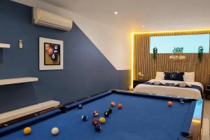 a bedroom with a pool table and a bed at Exclusive Villas in Kuşadası