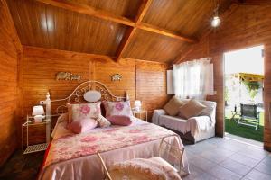 a bedroom with a bed and a chair in a room at los diablitos 4 in San Juan de la Rambla