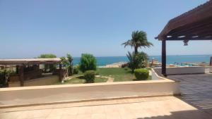 a view of the ocean from the balcony of a house at Hurghada Beach House in Hurghada