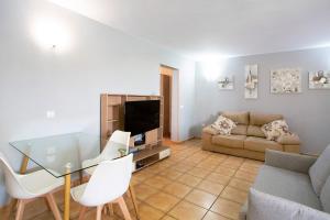 a living room with a glass table and a couch at Montemar 2 in Moya