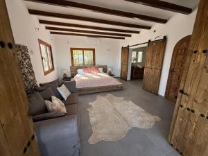 a living room with a couch and a bed at Caroix in Jávea +37 photos
