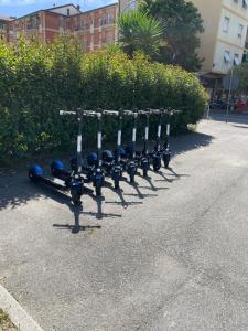 a row of exercise equipment lined up on a sidewalk at Casa Rebocco in La Spezia