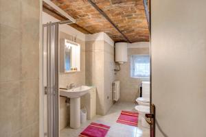 a bathroom with a sink and a toilet at Maison Jaccod_piano terra in Morgex +14 photos