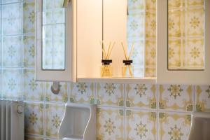a bathroom with a sink and a toilet in a room at Stablerhof Apt Löwenzahn in Cornedo all'Isarco +23 photos