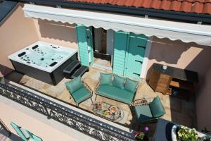 an overhead view of a patio with a tub at Heritage Holiday Home Rafica 365 Wellness Retreat in Božava