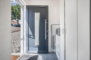 a door to a house with a blue door at Ferienwohnung Heide 2 in Walsrode