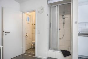 a bathroom with a shower and a toilet at Ferienwohnung Heide 2 in Walsrode +14 photos