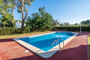 a swimming pool in a yard at Coma-ruga in El Vendrell