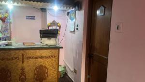 a room with a counter with a printer on it at R Krishna Hotel in Srinagar