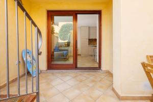 a door to a room with a view of a living room at Residence Orizzonti app n 3 in Golfo Aranci