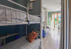 a room with two bunk beds and a hallway at Mono Le Lecce 25 b in Capoliveri
