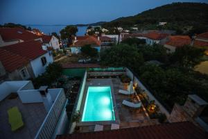 an overhead view of a swimming pool on a house at Heritage Holiday Home Rafica 365 Wellness Retreat in Božava +68 photos