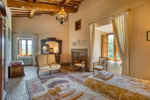 a bedroom with a bed and a fireplace at Castello di Magrano in Gubbio