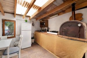 a kitchen with a stove and a counter top at Aloe Art in Teguise +12 photos