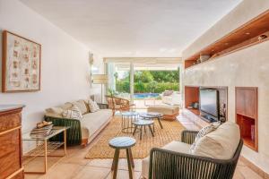 a living room with a couch and a fireplace at Casa Suca in Santa Ponsa
